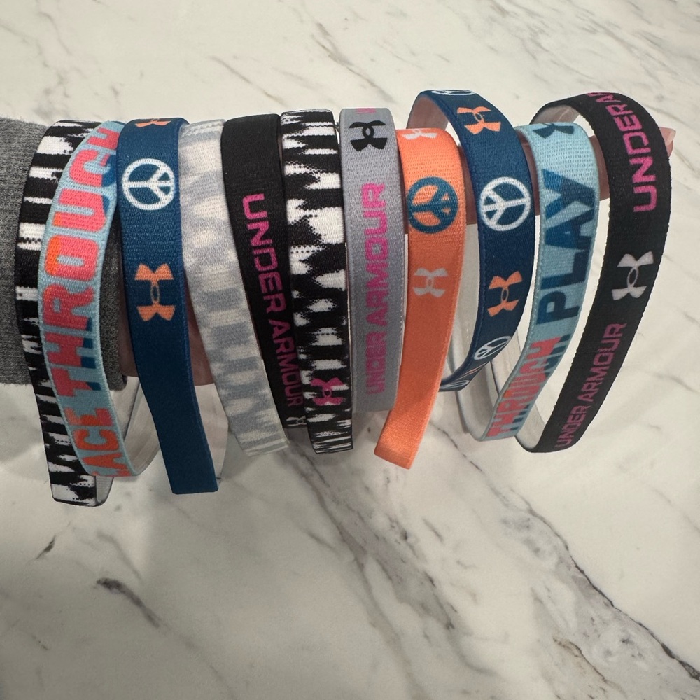 Under Armour Girls' Blue, Orange, Pink and Black Elastic Headband Set. 11 total